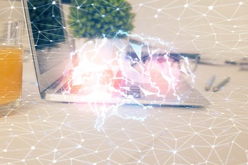 Multi exposure of work space with computer and human brain hologram. Brainstorm concept.