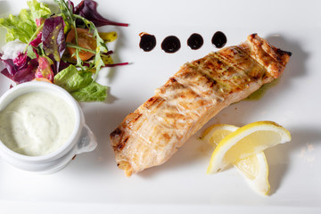 
fish dish on a plate in a restaurant