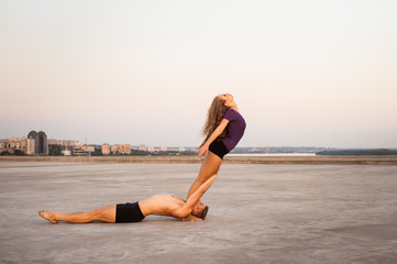girl and guy dancers perform a passionate dance together outdoors in nature