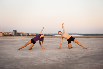 girl and guy dancers perform a passionate dance together outdoors in nature