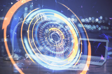 Computer on desktop in office with technology theme hologram. Multi exposure. Tech concept.