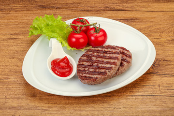 Grilled burger cutlet with sauce