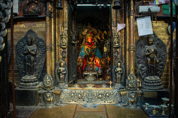 The beautiful ancient Buddha statue with red masked in Buddhist shrine in Kathmandu the capital cities of Nepal.