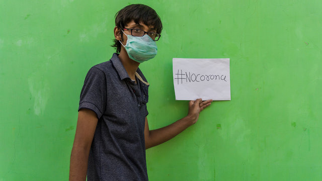 Young Man With Medical Mask Saying No To Corona Virus