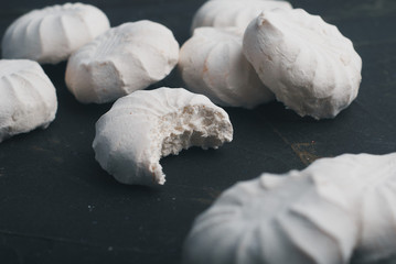 a bitten-off marshmallow among whole marshmallows. the concept of inferiority,