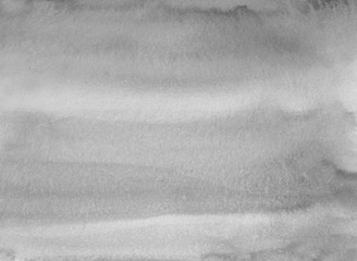 Watercolor neutral gray stains on paper background texture. Monochrome backdrop overlay. Abstract aquarelle black and white modern painting.