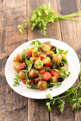 potato salad with tomato, lettuce and olive