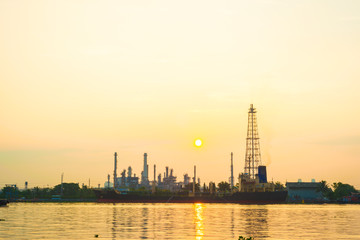 Fototapeta premium Oil refinery plant twilight petrochemical industry