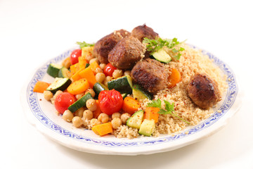 couscous with vegetable, semolina and meatball on white background