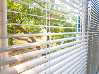 Office blinds. Modern iron shutters. Lighting control in the conference room.