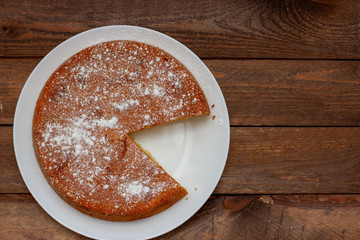 Homemade Apple Pies on wooden background, top view, copy space