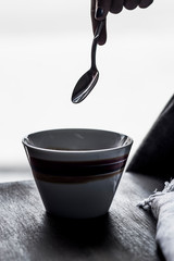 backlit cup of coffee with spoon