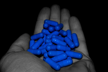 pills scattered in the palm of your hand