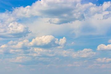 Cloudy weather, summer blue sky with lush cumulus clouds, cloudscape background wallpaper backdrop. Natural sky for design