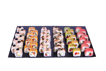 sushi set Dragon rolls with fresh ingredients on black stone isolated on white background. Sushi menu. Japanese food.