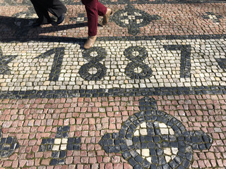 Cobblestone street with the date 1887 formed out of stones
