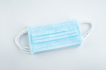 Disposable medical mask on white background