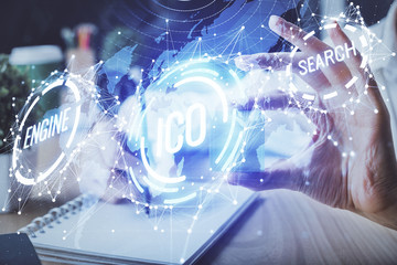 Cryptocurrency hologram over hands taking notes background. Concept of blockchain. Multi exposure