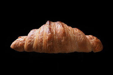 Croissant on black background