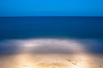 Sea coast and beach at night. Pieria, Greece. Illuminated art concept.