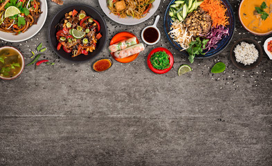 Asian food background with various ingredients on rustic stone background , top view. Vietnam or Thai cuisine.