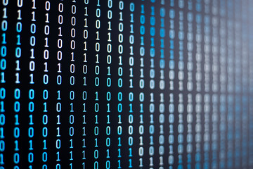 Binary code of different colours on computer screen. Concept of information, coding, data, cloud...