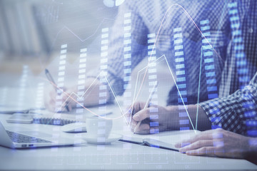 Multi exposure of forex chart with man working on computer on background. Concept of market analysis.