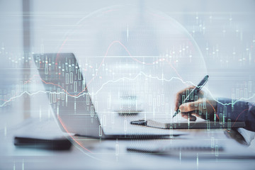 Multi exposure of forex chart with man working on computer on background. Concept of market analysis.