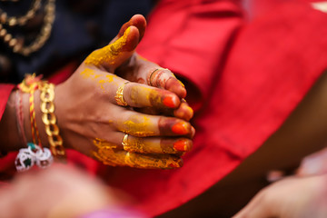 Indian wedding photography, Haldi ceremony groom hands