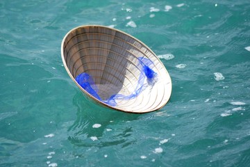 ASIAN HAT IN THE SEA