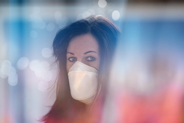 Woman in city with a face mask against infection and viruses such as corona virus, sars or flu.