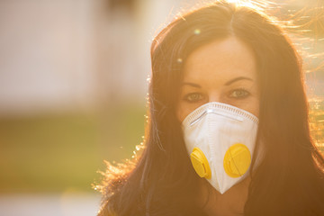 Woman in city with a face mask against infection and viruses such as corona virus, sars or flu.