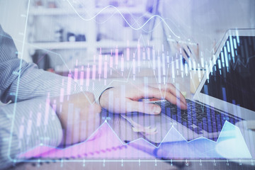 Multi exposure of stock market chart with man working on computer on background. Concept of financial analysis.