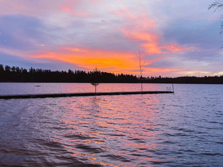 Orange sunrise on a lake in Sweden.