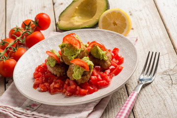 meatballs with fresh tomatoes salad and avocado cream