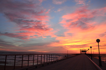 Fototapeta na wymiar sunset on the sea pier