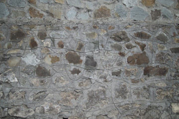 old dark wall of natural stone