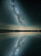 Mystical lake in starry night. - 335514599