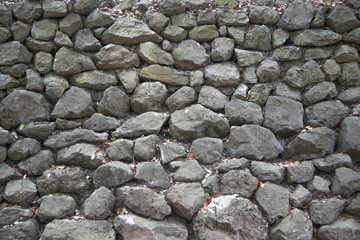 old dark wall of natural stone