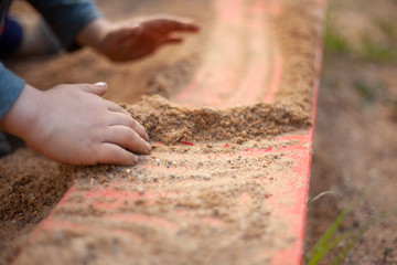 A child plays on the street.