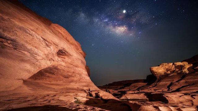 4K Motion Time lapse of milky way and sunrise over Sam Pan Bok canyon, Ubon ratchathani, Thailand 