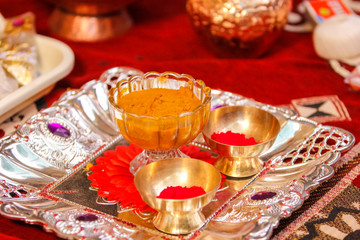 Traditional wedding ceremony in Hinduism: Turmeric in plate for haldi ceremony