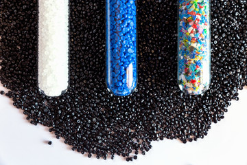 Close-up of plastic polymer granules. hand hold Polymer pellets. polymer plastic. compound polymer. - obrazy, fototapety, plakaty