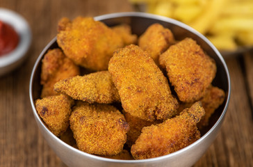 Vintage wooden table with fresh made Chicken Nuggets