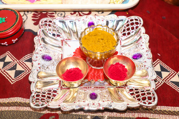 Traditional wedding ceremony in Hinduism: Turmeric in plate for haldi ceremony