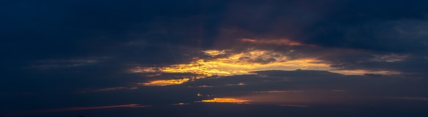 Panorama of clouds at sunset.