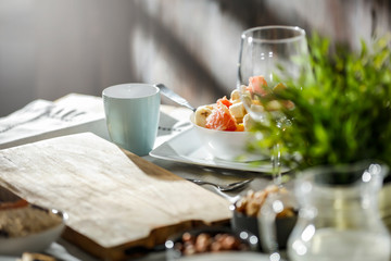 Breakfast on the table on a beautiful holiday morning with free space for an advertising product