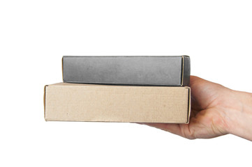 several cardboard boxes in hand