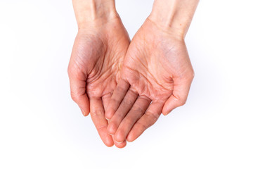 Woman holds hands out on white background from the top