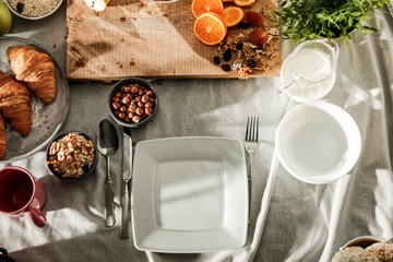 Breakfast on the table on a beautiful holiday morning with free space for an advertising product
